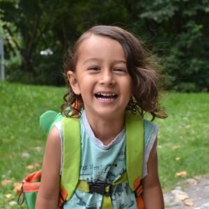portrait-smiling-girl-against-trees